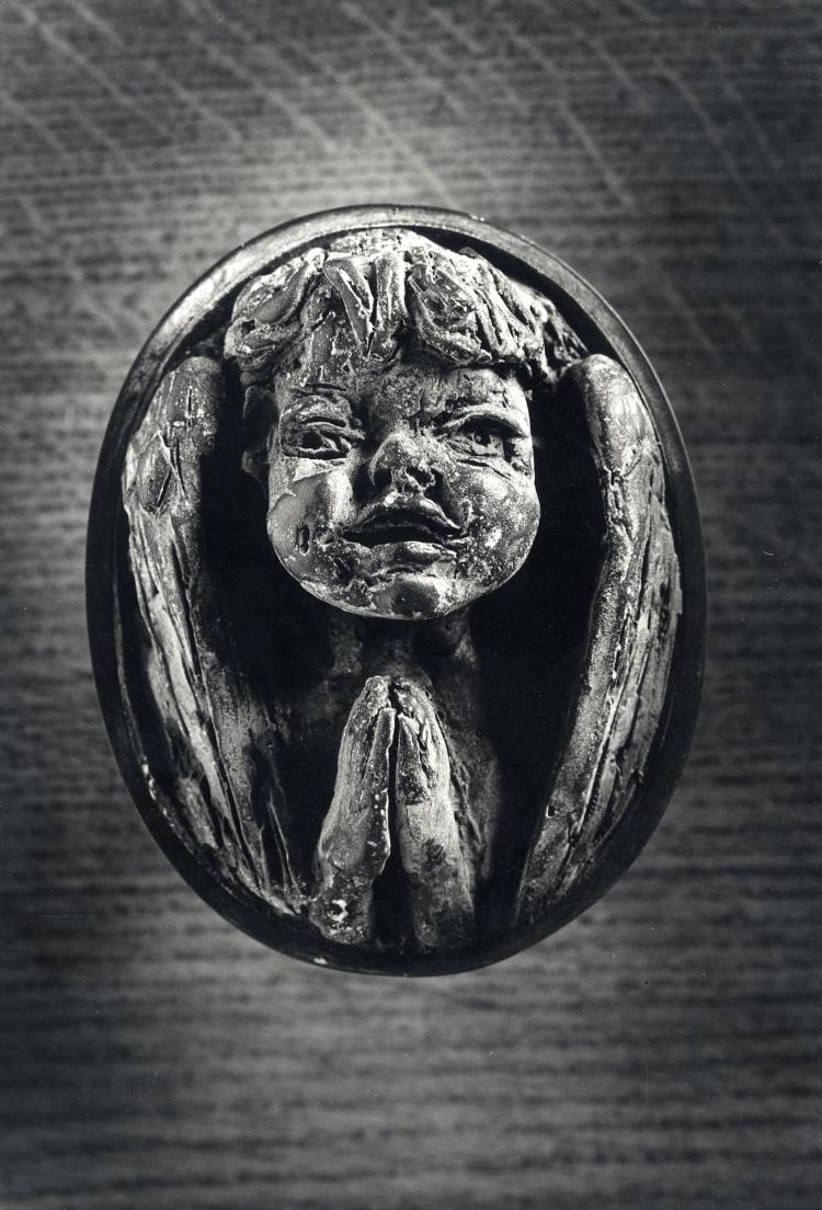 Door handle depicting child praying