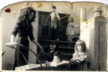 Photograph of Roland Joffe as a boy playing with Esther Garman and others